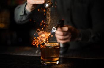 bartender-flaming-a-cocktail