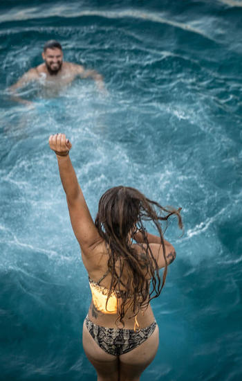 Girl jumping on water 