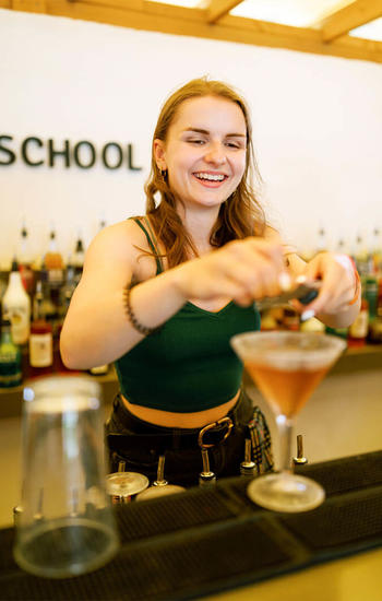 Student preparing cocktail